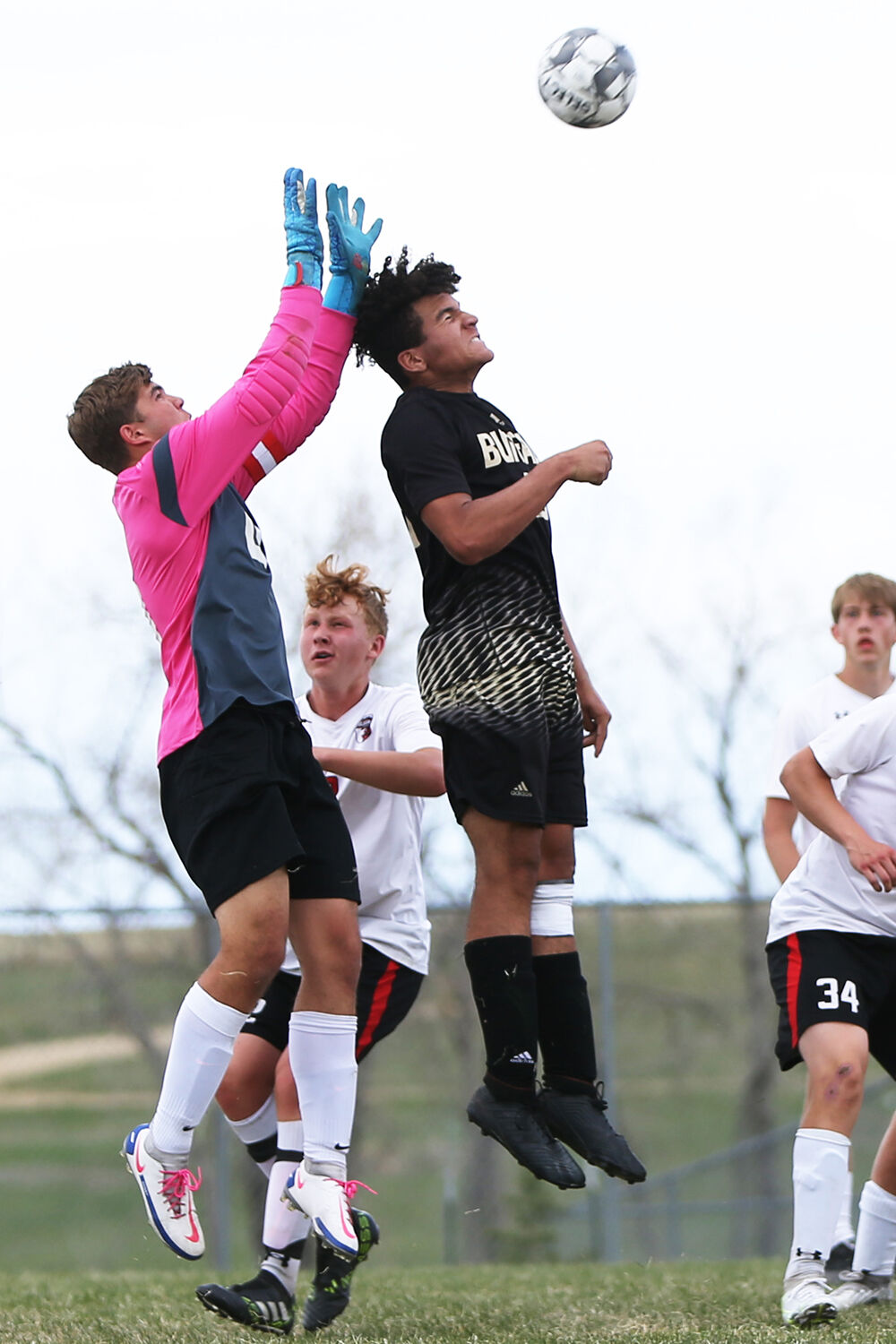 Kadon Boyce jumps up to head a ball
